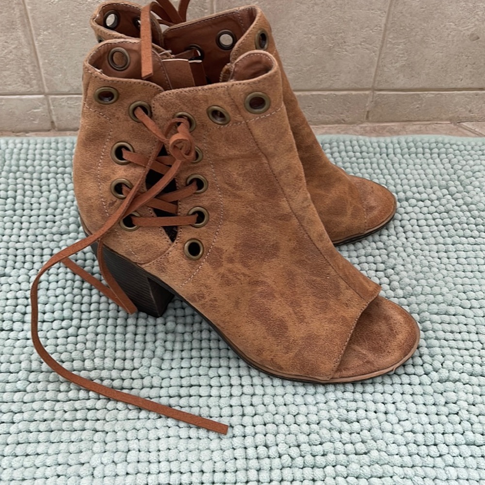 Beautiful booties. Toe out. Like new. Never worn